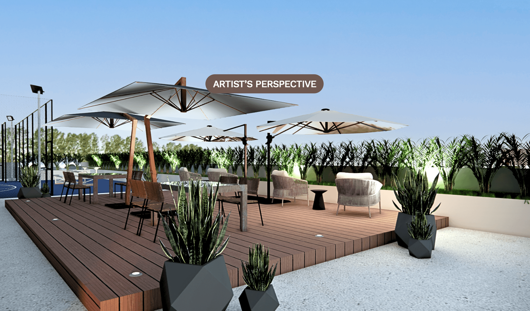 The roofdeck lounge with timber decking, lounge seating, and parasols at dusk.